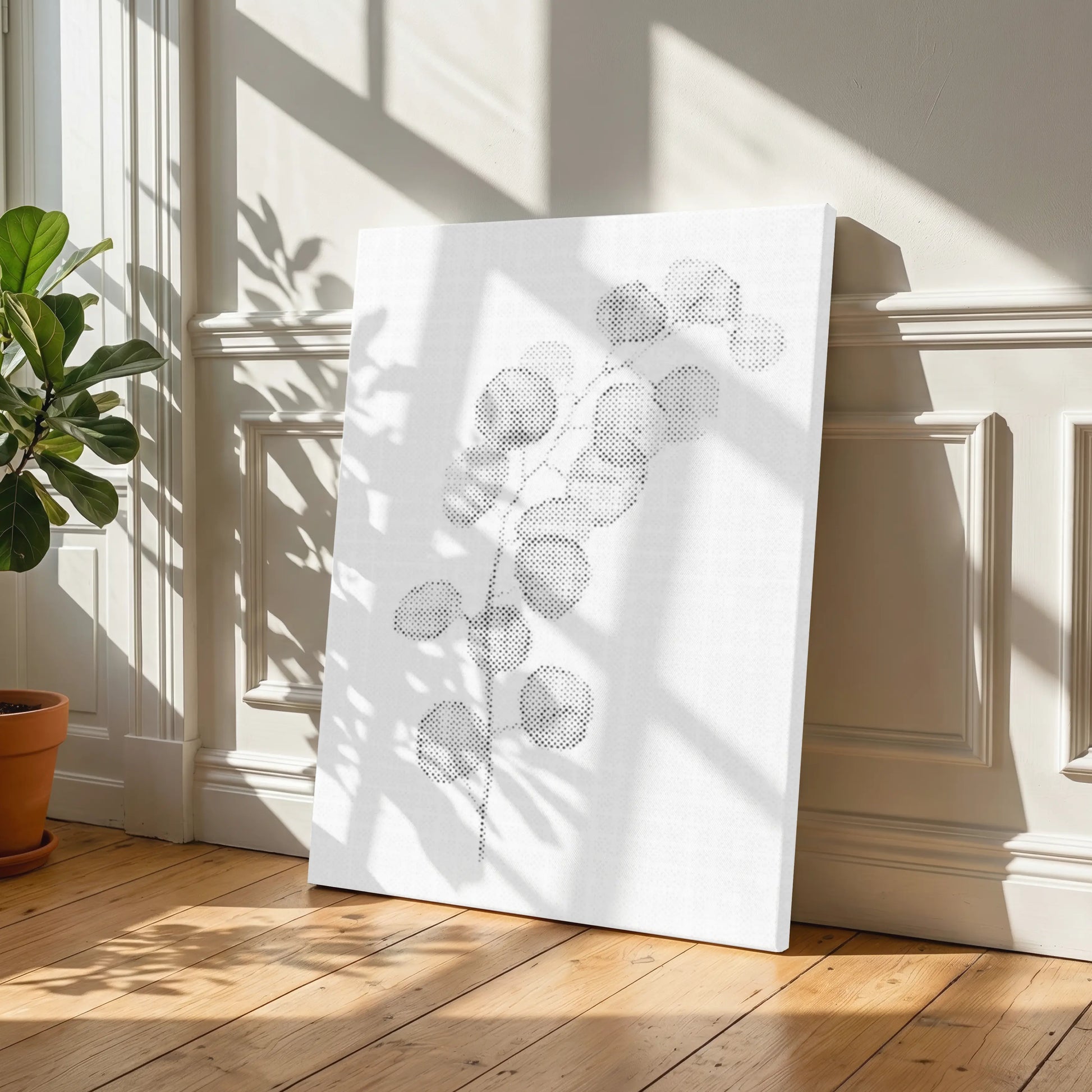 White decorative panel with geometric patterns on a wooden floor in a sunlit room. Eucalyptus Branch | Dot Painting Kit