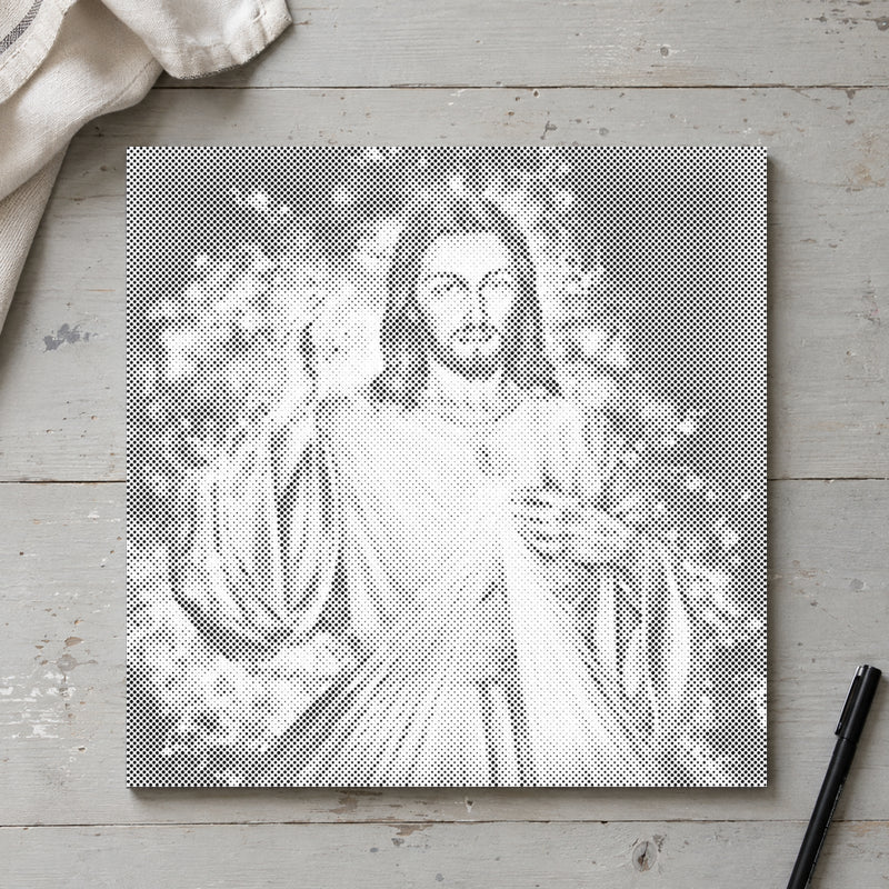 Prickmålningen “Jesus: fortsättningen”, sedd ovanifrån på ett arbetsbord i mjukt dagsljus.