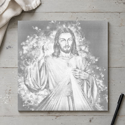 Prickmålningen “Jesus: fortsättningen”, sedd ovanifrån på ett arbetsbord i mjukt dagsljus.