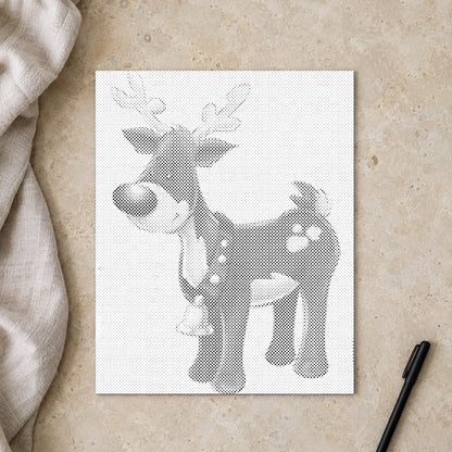 Prickmålningen “Rudolf med röda mulen”, sedd ovanifrån på ett arbetsbord i mjukt dagsljus.